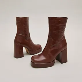 Boots with heels and square toes in brown aged leather